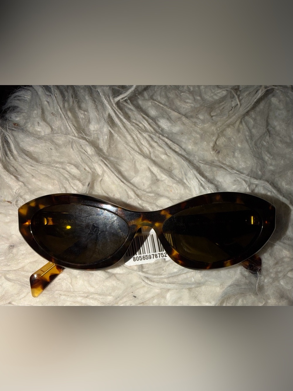 Prada Women's Tortoiseshell Sunglasses with Dark Lenses